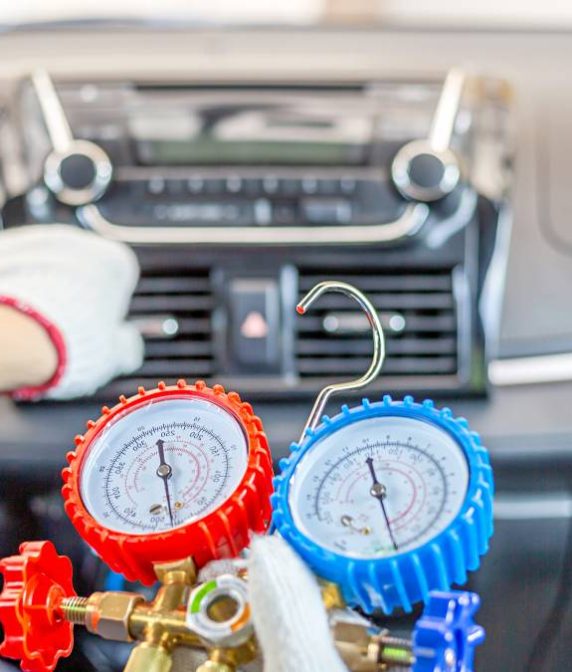 Repairman holding monitor tool to check and fixed car air conditioner system, Technician check car air conditioning system refrigerant recharge, Air Conditioning Repair